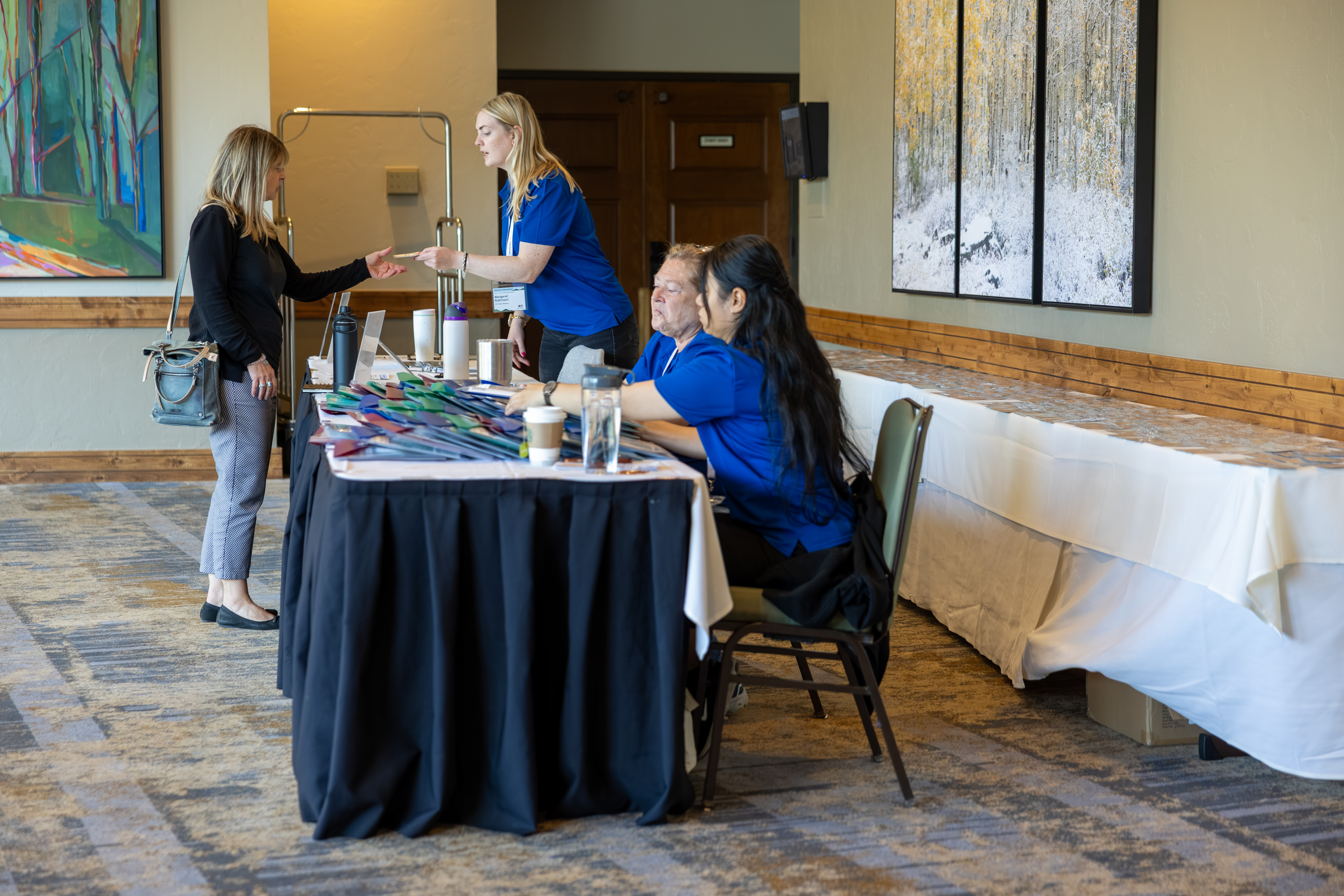 participants visiting an information booth