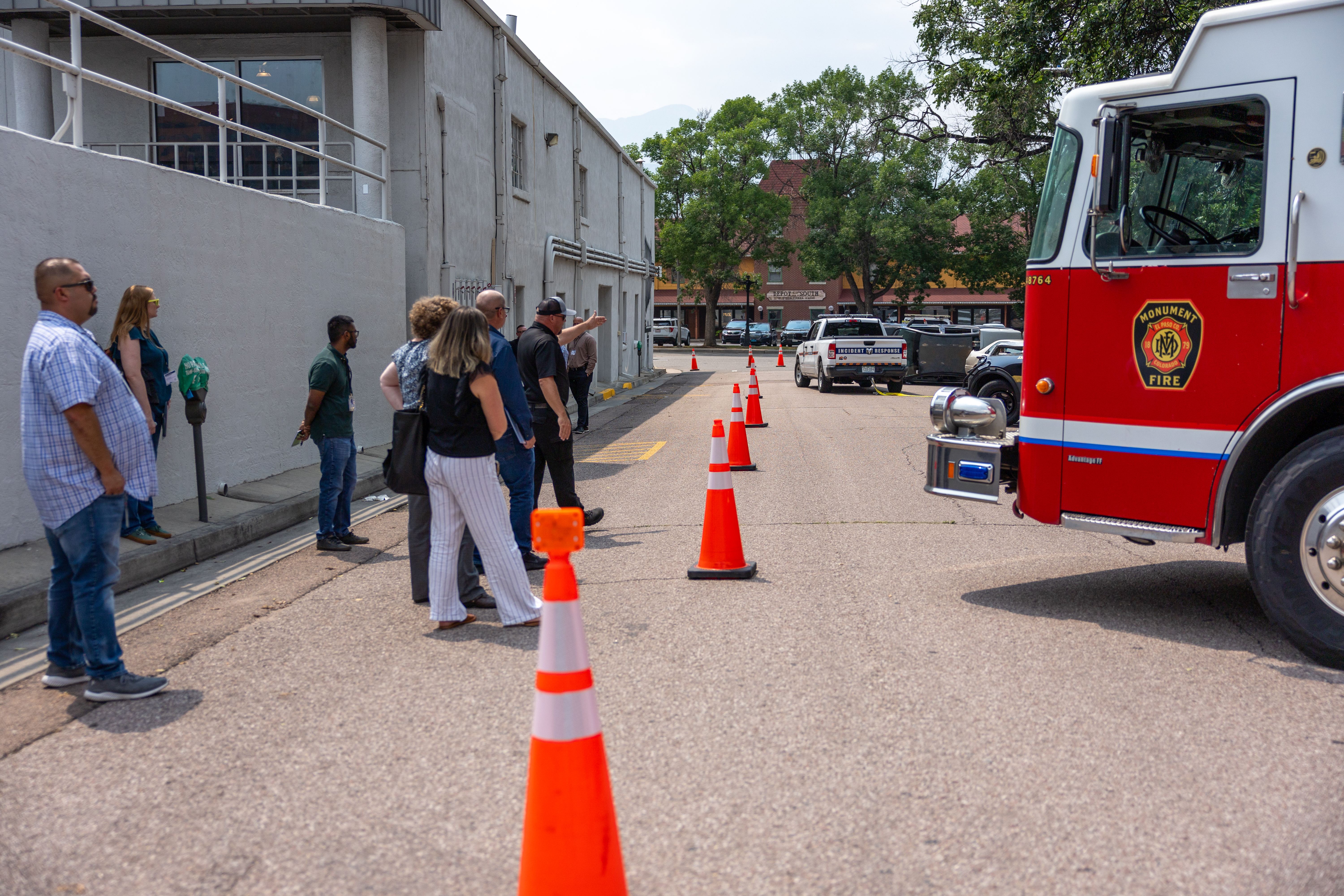 outdoor portion of summit involving firetruck and street cones